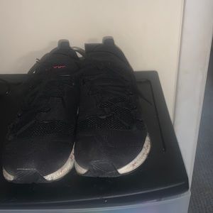 Black Asics with red blue and white soles